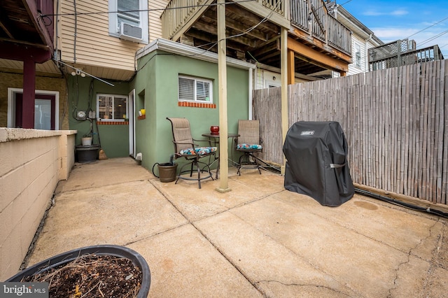 view of patio / terrace featuring fence and grilling area