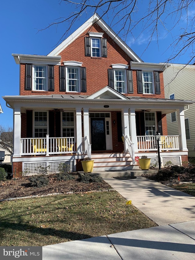 view of front of house with brick siding and a porch