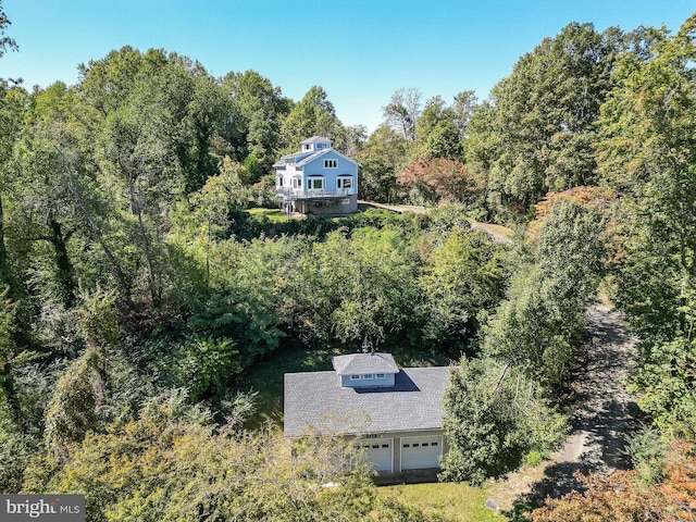 drone / aerial view featuring a view of trees