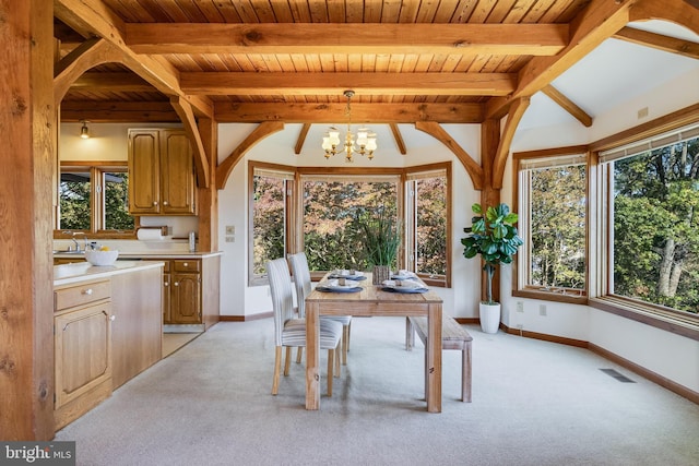 5112 Shore Dr, Huntingtown, MD 20639 - dining space featuring a healthy amount of sunlight, visible vents, beam ceiling, light colored carpet, and a chandelier