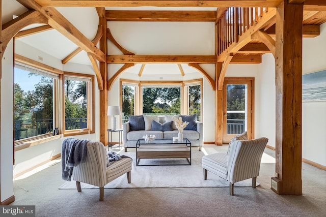 5112 Shore Dr, Huntingtown, MD 20639 - living area featuring baseboards, vaulted ceiling with beams, and carpet