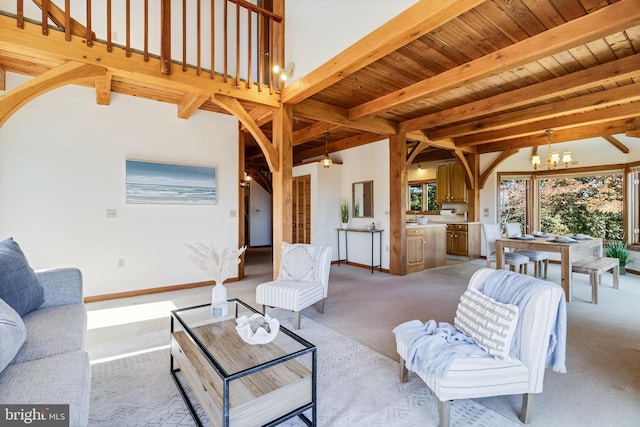5112 Shore Dr, Huntingtown, MD 20639 - living room with beam ceiling, a notable chandelier, and light colored carpet