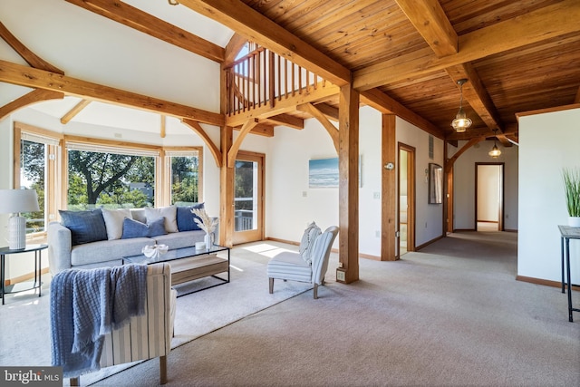 5112 Shore Dr, Huntingtown, MD 20639 - unfurnished living room featuring baseboards, beamed ceiling, wood ceiling, carpet floors, and arched walkways