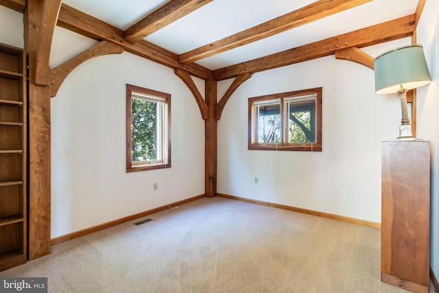 5112 Shore Dr, Huntingtown, MD 20639 - spare room featuring baseboards, visible vents, carpet floors, and beamed ceiling