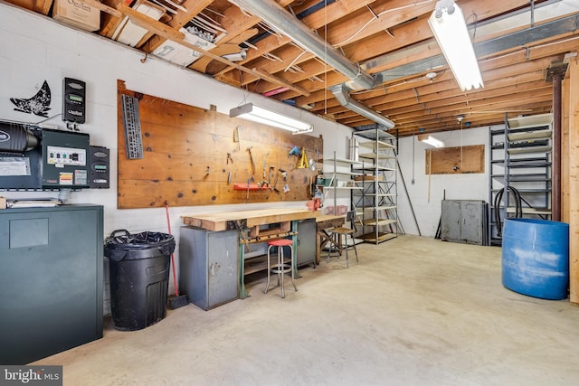 5112 Shore Dr, Huntingtown, MD 20639 - unfinished basement with a workshop area