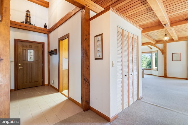 5112 Shore Dr, Huntingtown, MD 20639 - carpeted entrance foyer with wooden ceiling, beamed ceiling, baseboards, and tile patterned floors