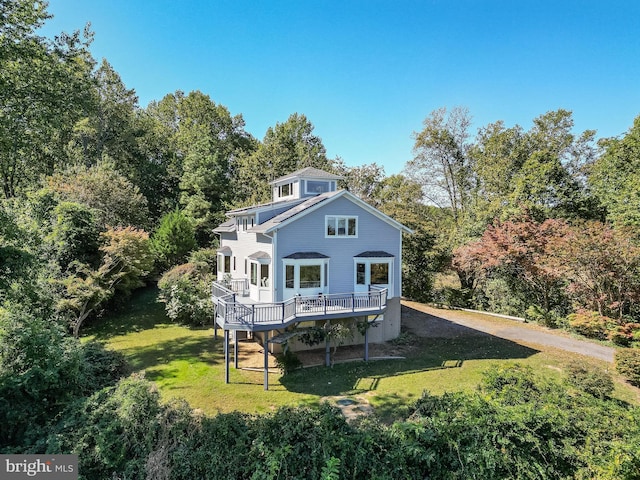 5112 Shore Dr, Huntingtown, MD 20639 - back of property featuring a lawn and a deck
