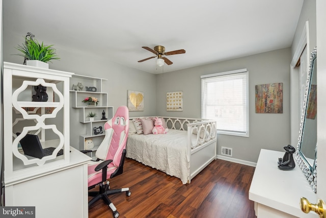 bedroom with a ceiling fan, dark wood-style flooring, visible vents, and baseboards