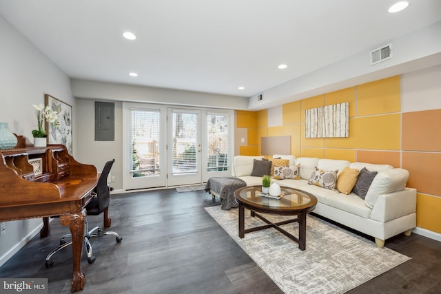 living room featuring electric panel, baseboards, visible vents, dark wood-style flooring, and recessed lighting