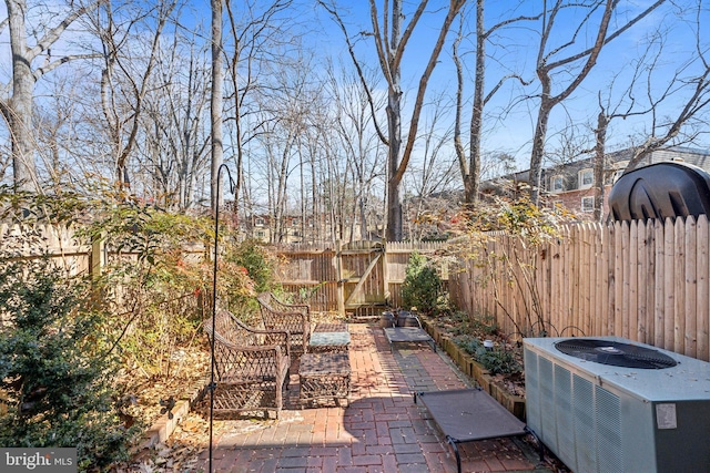 view of patio / terrace with fence and central AC unit