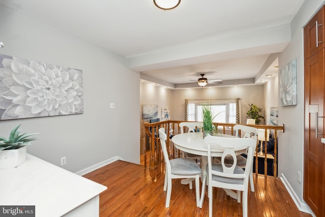 dining room with light wood finished floors and baseboards