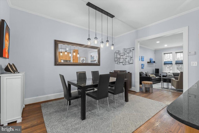2652 Woodley Pl NW, Washington, DC 20008 - dining space with wood finished floors, crown molding, and baseboards