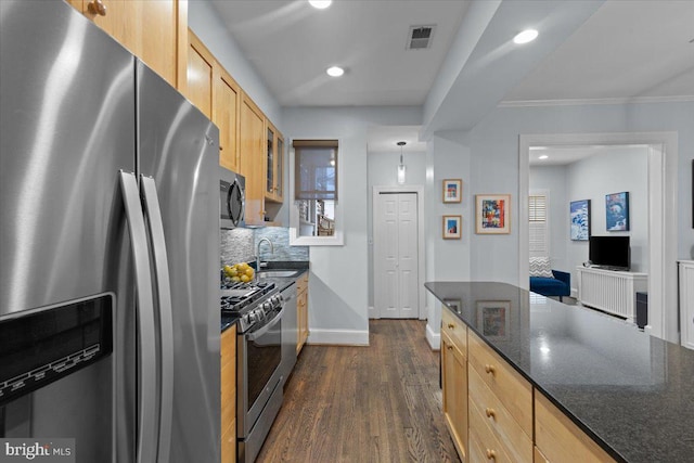 2652 Woodley Pl NW, Washington, DC 20008 - kitchen featuring appliances with stainless steel finishes, light brown cabinetry, glass insert cabinets, dark wood-type flooring, and tasteful backsplash