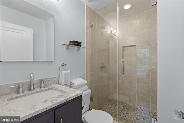 2652 Woodley Pl NW, Washington, DC 20008 - bathroom with vanity, a shower stall, and toilet