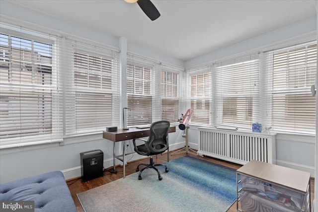 2652 Woodley Pl NW, Washington, DC 20008 - home office featuring radiator heating unit, healthy amount of natural light, baseboards, and wood finished floors
