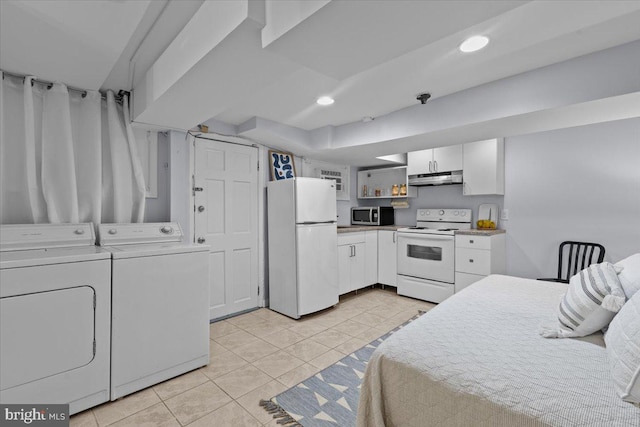 2652 Woodley Pl NW, Washington, DC 20008 - bedroom with freestanding refrigerator, separate washer and dryer, light tile patterned floors, and recessed lighting