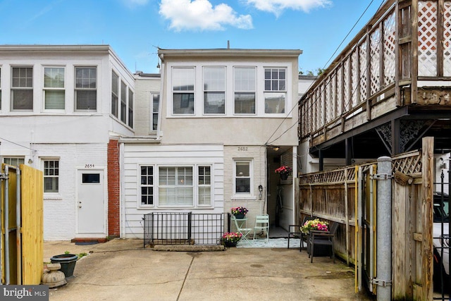 2652 Woodley Pl NW, Washington, DC 20008 - back of property with a patio area and stucco siding