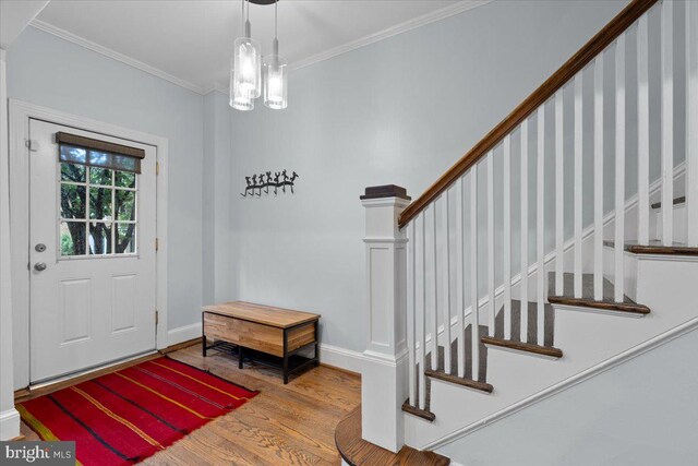 2652 Woodley Pl NW, Washington, DC 20008 - entryway with wood finished floors, ornamental molding, baseboards, and stairs