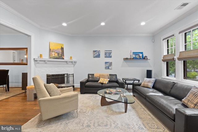 2652 Woodley Pl NW, Washington, DC 20008 - living room with ornamental molding, wood finished floors, recessed lighting, a fireplace, and baseboards