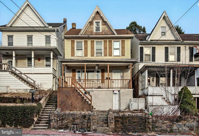 view of front of property with a porch and stairway