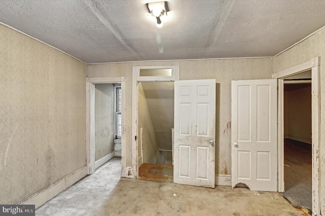 unfurnished bedroom featuring concrete flooring