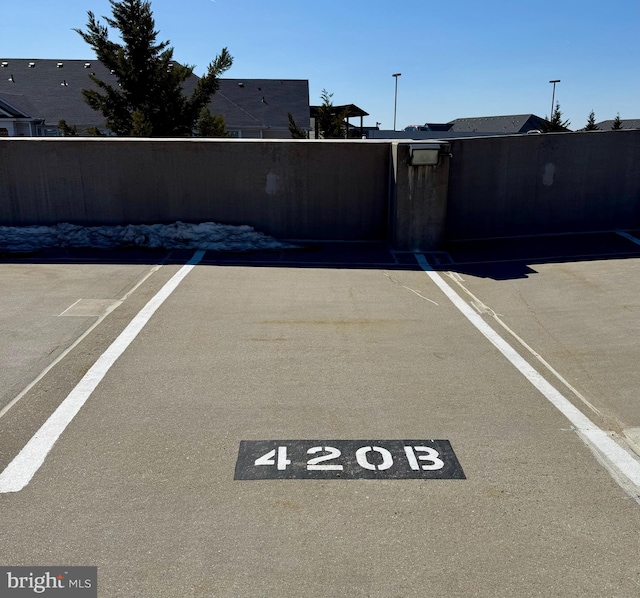 uncovered parking lot featuring a gate