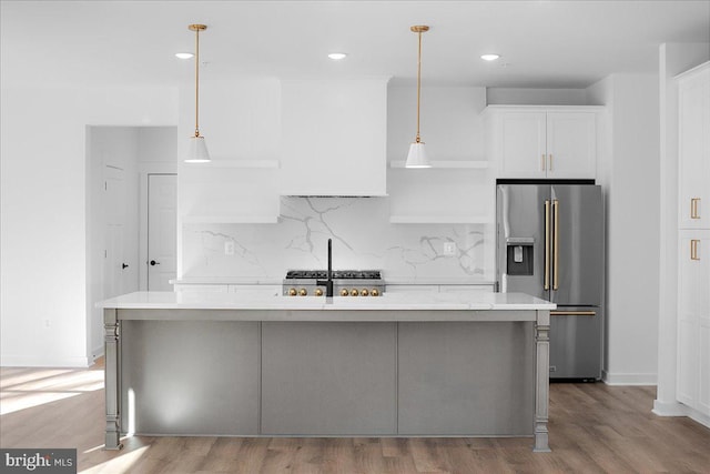 kitchen with tasteful backsplash, stainless steel fridge with ice dispenser, light countertops, light wood-style floors, and white cabinetry