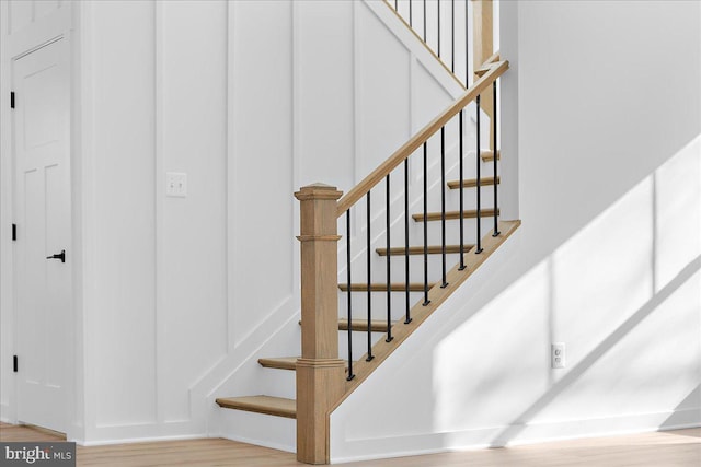 stairs with wood finished floors