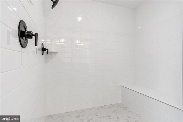 details featuring tiled shower