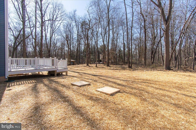 view of yard with a wooden deck