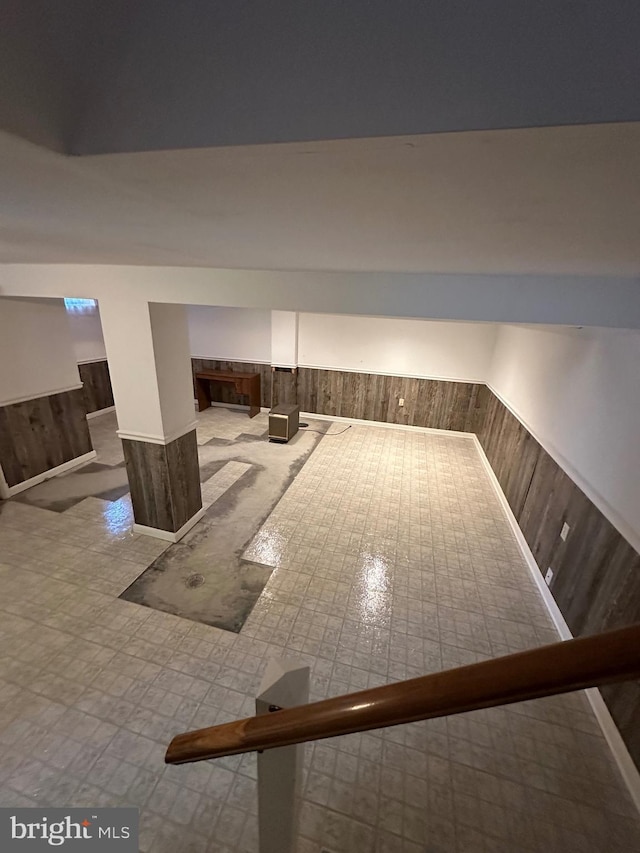 interior space featuring wood walls and wainscoting