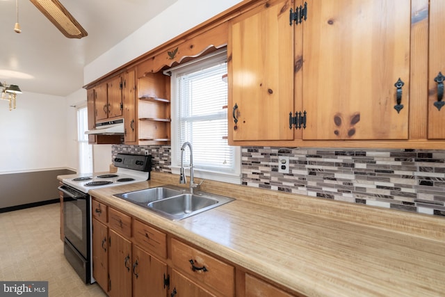 kitchen featuring open shelves, light countertops, a sink, range with electric cooktop, and under cabinet range hood