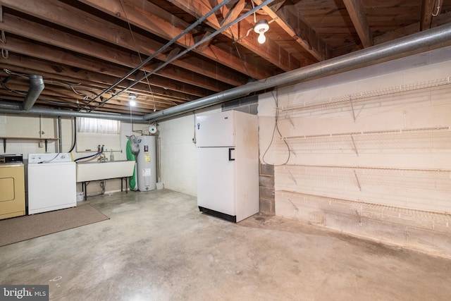 unfinished basement featuring separate washer and dryer, a sink, and electric water heater