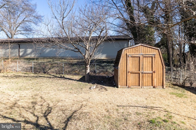 view of shed featuring fence