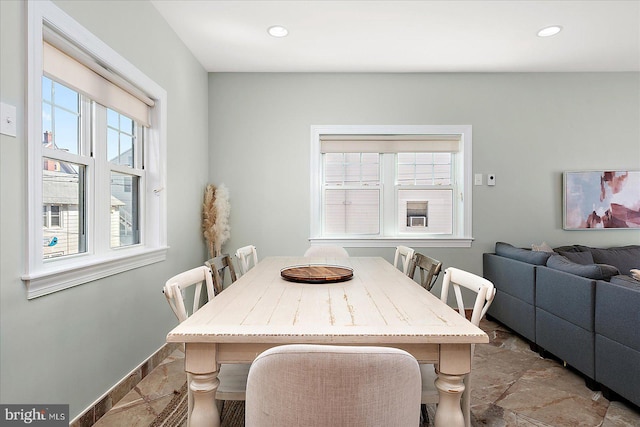 dining area featuring baseboards and recessed lighting