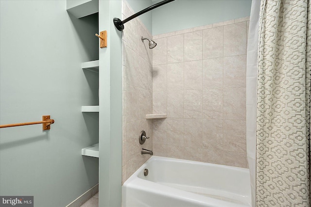 bathroom with shower / bath combination with curtain