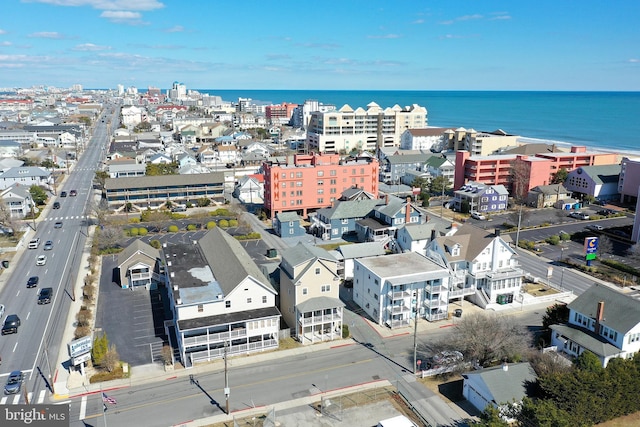 drone / aerial view with a view of city and a water view