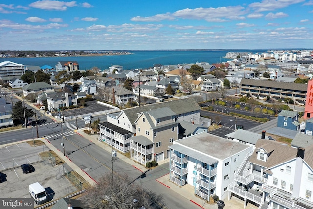 bird's eye view with a residential view and a water view