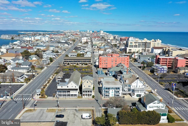 drone / aerial view featuring a view of city and a water view