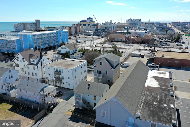 drone / aerial view featuring a water view and a city view