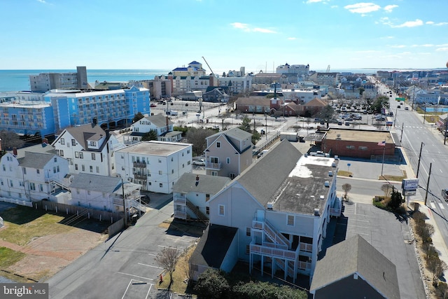 birds eye view of property with a city view and a water view