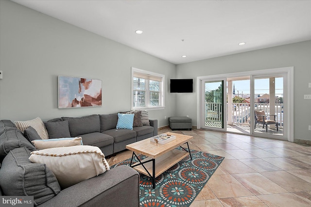 living room with light tile patterned floors, a wealth of natural light, and recessed lighting