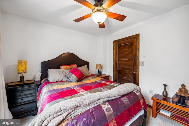 carpeted bedroom with ceiling fan