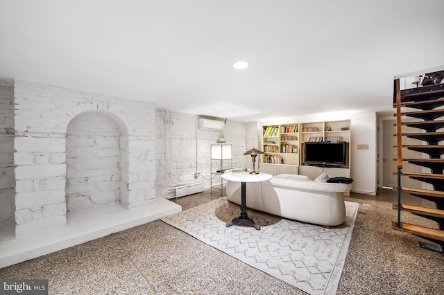 living room with a wall mounted AC, a baseboard radiator, and recessed lighting