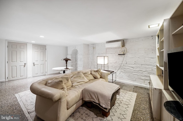 living room featuring a wall unit AC and recessed lighting