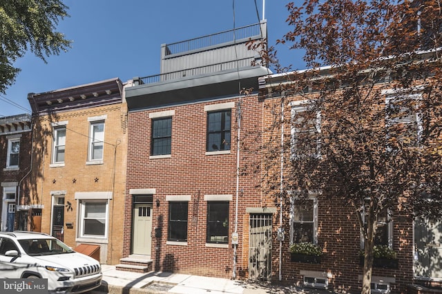 view of property with brick siding