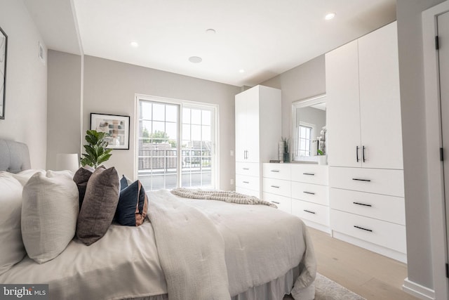 bedroom with light wood-type flooring, access to outside, visible vents, and recessed lighting