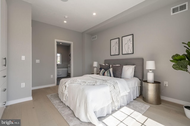 bedroom with recessed lighting, visible vents, light wood-style flooring, and baseboards