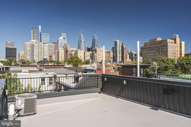 view of patio / terrace featuring a view of city and central AC unit