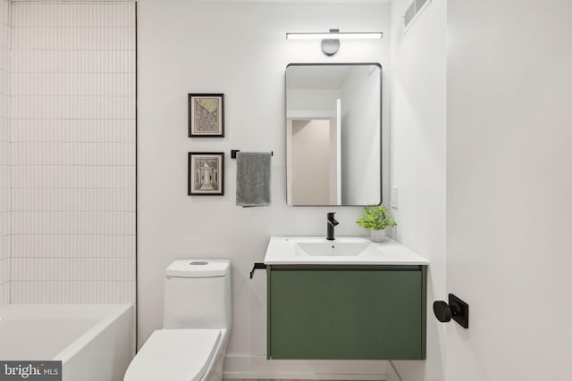 bathroom featuring visible vents, vanity, and toilet